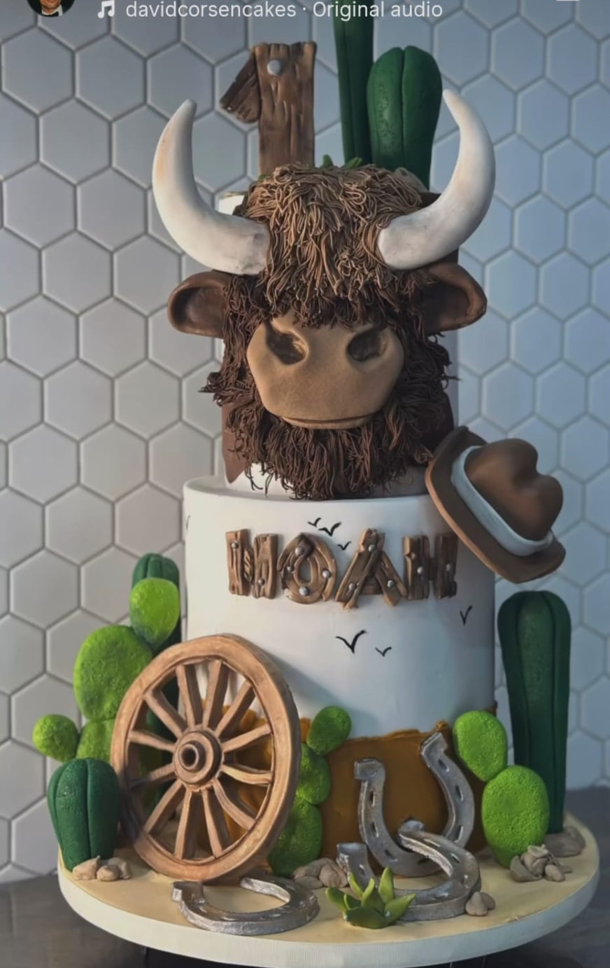 Cowboy birthday cake with highland cow